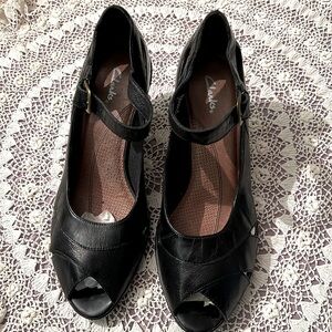 Brand new CLARKS Black open toe heel shoes with slot design on sides. Size 10
